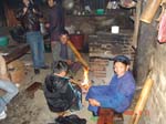 cha village heating the house with a fire and smoking the water pipe